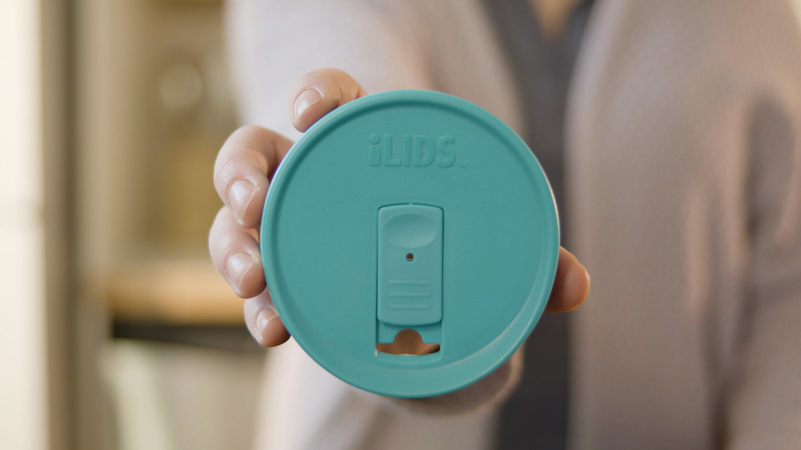 iLids brand film: drink and storage lids on mason jars in a kitchen